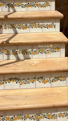 the stairs are decorated with yellow flowers and leaves