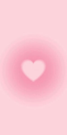 a pink background with a white heart in the center