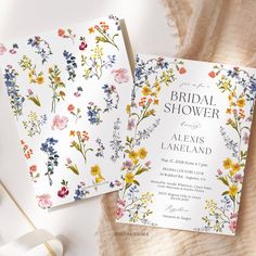 two wedding cards with floral designs on them