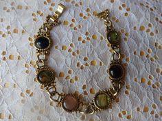 This is a Vintage Gold Tone Cabochone Abalone Charms measures 7 inches in length this bracelet is super pretty good condition  If you have any questions first refer to the photos or email/message Me please/thanks Items ships within 1-3 days sometimes sooner with payment I ship USPS to the US only first class mail up to 13 oz anything above 13 oz I usually us priority mail flat rate boxes or envelopes  International is responsible for shipping fees and charges  PLEASE MESSAGE ME BOUT SHIPPING CHA Vintage Beaded Bracelet, Funky Bracelet, Email Message, Gold Alloys, Bohemian Bracelets, Bracelet Ideas, Glass Beaded Bracelets, Rhinestone Bead, Gift List