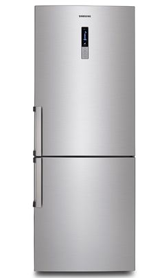 a silver refrigerator freezer sitting on top of a white floor