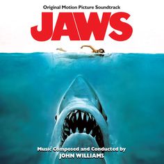 the movie poster for jaws features a shark with its mouth open