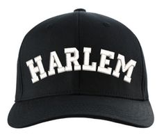 a black hat with the word harlem written in white on it's front side