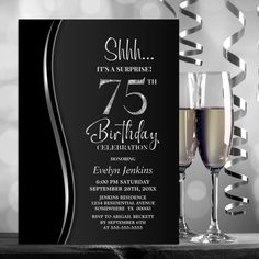 a black and white birthday party card with two glasses of wine on the table next to it