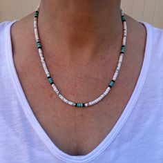 This Native American inspired beaded heishi necklace is made with natural white buffalo turquoise from Nevada, blue green turquoise, black onyx, and sterling silver spacer beads.  The beads are uniform in size, making for a clean flowing pattern of semi precious gemstones. Modeled in both 18" and 20". The AAA grade white buffalo turquoise beads are beautiful shades of gray and white polished to a fine quality semi gloss luster that compliments that of the green turquoise and black onyx.  White B Adjustable White Turquoise Necklace With Natural Stones, White Heishi Beads Hand-strung Necklaces, White Heishi Beads Necklaces Hand-strung, White Hand-strung Heishi Bead Necklaces, Bohemian Style Turquoise Gemstone Beads Necklace, White Turquoise Necklace With Natural Stones, Adjustable, Hand-strung White Heishi Bead Necklaces, White Southwestern Hand-strung Necklaces, Bohemian White Turquoise Gemstone Beads Necklace