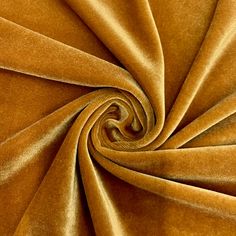 a close up shot of a gold velvet fabric