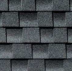 a close up view of a roof with gray shingles