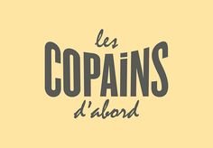 the words les copains d'albard are black and white on a yellow background