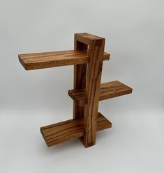 a wooden shelf sitting on top of a white floor