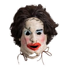 a creepy clown mask with black hair and red lips