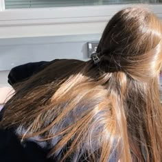 the back of a woman's head with long hair