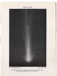 a black and white photo of an object in the sky with stars coming out of it