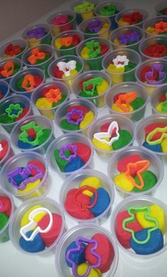 plastic containers filled with cupcakes shaped like letters and numbers