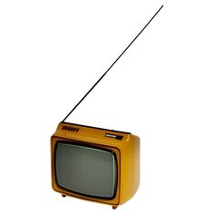 an old fashioned television set with antenna attached to it