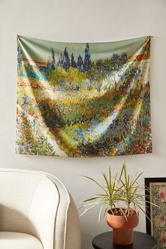 a tapestry hanging on the wall in a living room