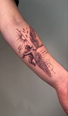 a person's arm with a tattoo on it that has an eagle and words