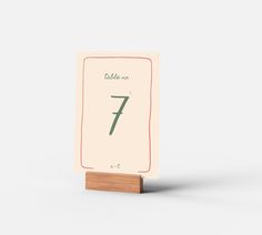 a table number card with the number seven on it