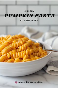 healthy pumpkin pasta for toddlers in a white bowl on a marble countertop with text overlay