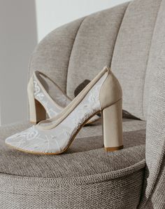 a pair of shoes sitting on top of a chair