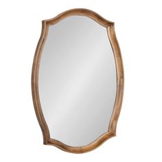 an oval wooden mirror on a white background