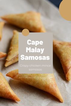 some samosas that are sitting on a piece of parchment paper with the words cape malay samosas