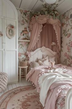 a bedroom decorated in pink and white with flowers on the walls, bedding and curtains