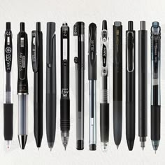 several different types of pens lined up next to each other