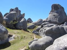 some rocks and grass on a sunny day