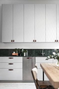 the instagram page on instagram com shows an image of a kitchen with white cabinets