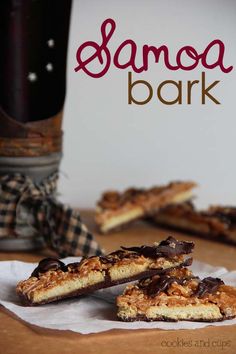 three pieces of chocolate and oatmeal cookie bar on top of a piece of parchment paper