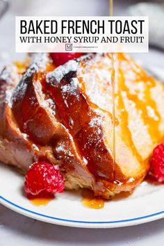 french toast with honey syrup and fruit on a plate