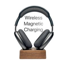 wireless magnetic charging headphones on a wooden stand with the words wireless magnet charging above it