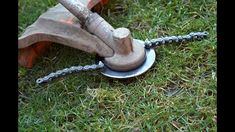 an old chain saw is laying on the grass with it's blades still attached