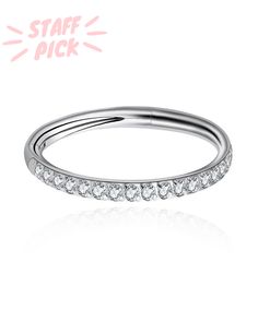 a white gold wedding band with five diamonds on the bottom and an inscription staff pick