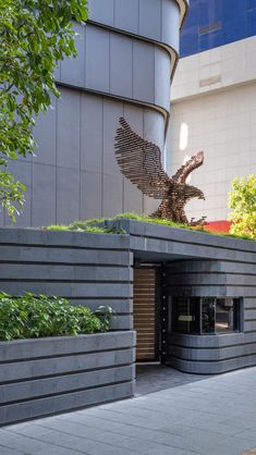 an eagle sculpture on the side of a building