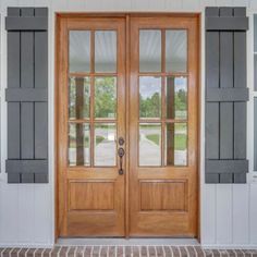 two wooden doors sitting next to each other