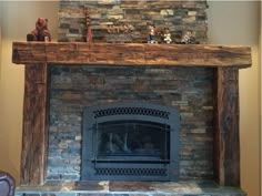 a stone fireplace in a living room with stuffed animals on the mantle