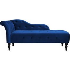 a blue couch sitting on top of a white floor