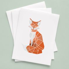 three folded cards with an orange fox on one side and white paper on the other