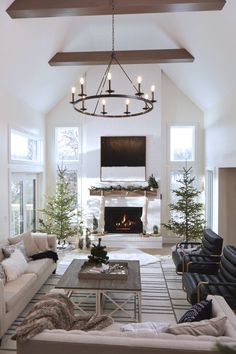 a living room filled with furniture and a fire place in the middle of a room