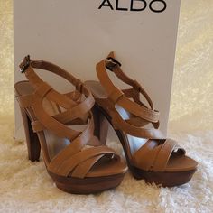 Aldo Heels Perfect For The Summer...New In Box.. All Sales Are Final... Summer Open-heel Wooden Heels, Brown Sandals With 4-inch Open Heel, Brown Heels With 4-inch Heel And Medium Width, Open Heel Sandals In Calf Leather With Gold-tone Hardware, Aldo Heels, Brown Synthetic Heels With 4-inch Heel, Aldo Shoes, Heels Sandals, Sandals Heels