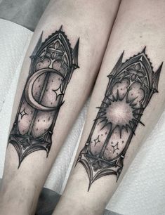 two legs with tattoos on them, one has a clock and the other has stars