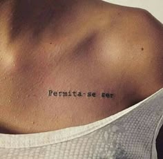 the back of a woman's neck with an inscription on it that reads permitse