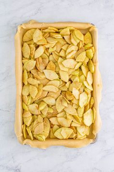 an uncooked apple pie sitting on top of a counter