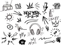 an image of graffiti written on the wall with headphones and other things around it