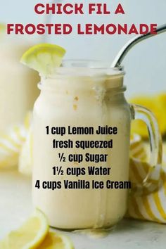 a jar filled with lemon juice next to some sliced lemons and a cup of ice cream