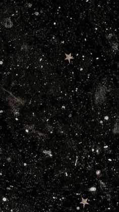 an image of stars and snow in the night sky on a black background with white spots