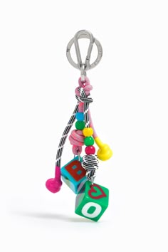 a keychain that has various toys hanging from it's sides and on the end