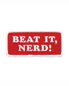 a red and white patch with the words beat it nerd