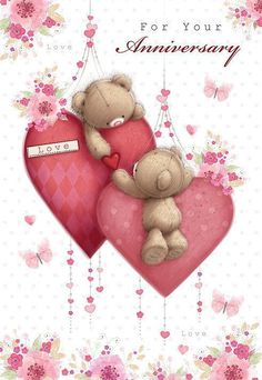 two teddy bears sitting on top of a heart shaped pillow with the words, for your anniversary